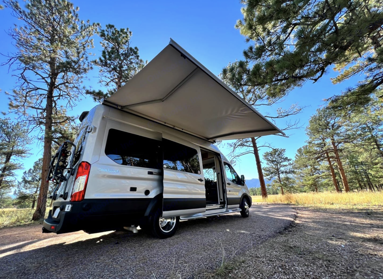 Camper van awning extended for outdoor living space